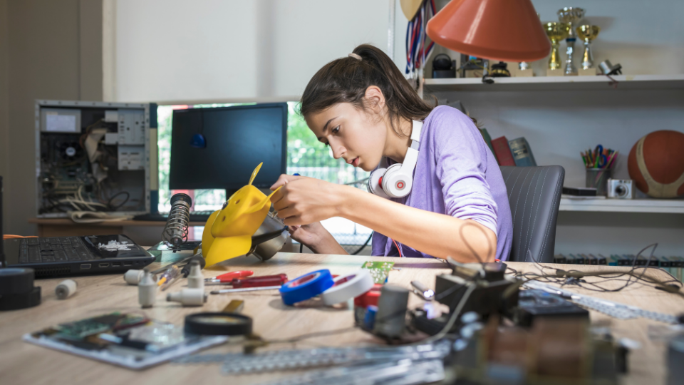 A woman fixing hardware