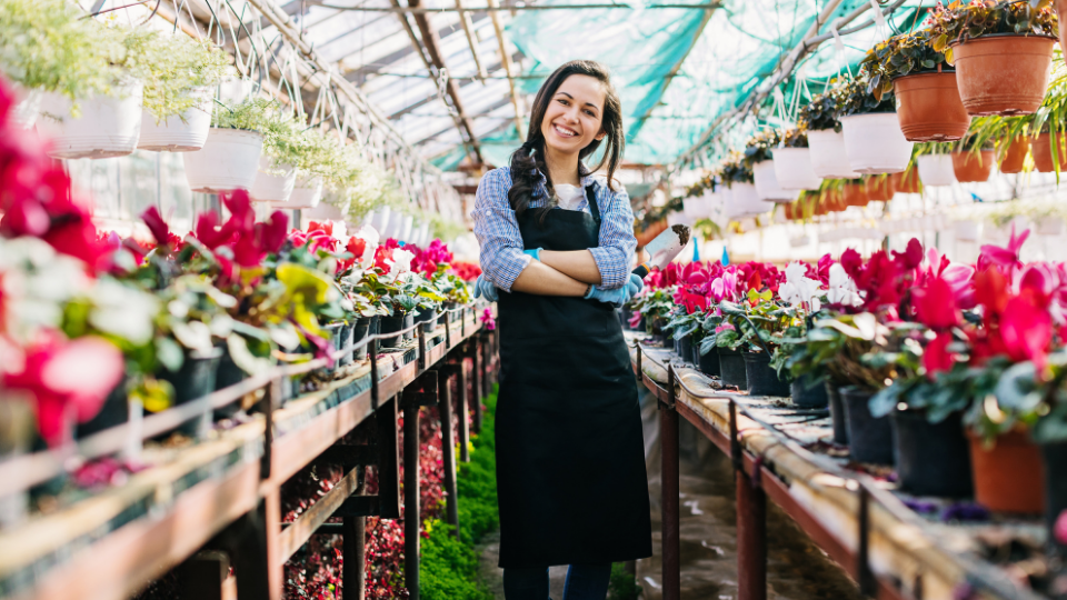A happy and young business owner starting to get her business off the ground