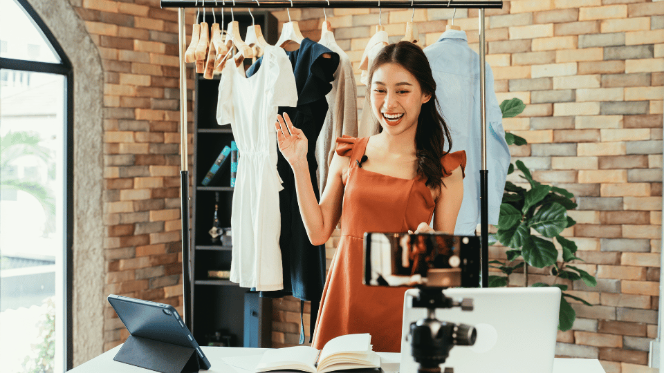 a top female instagram influencer showing a rack of clothes