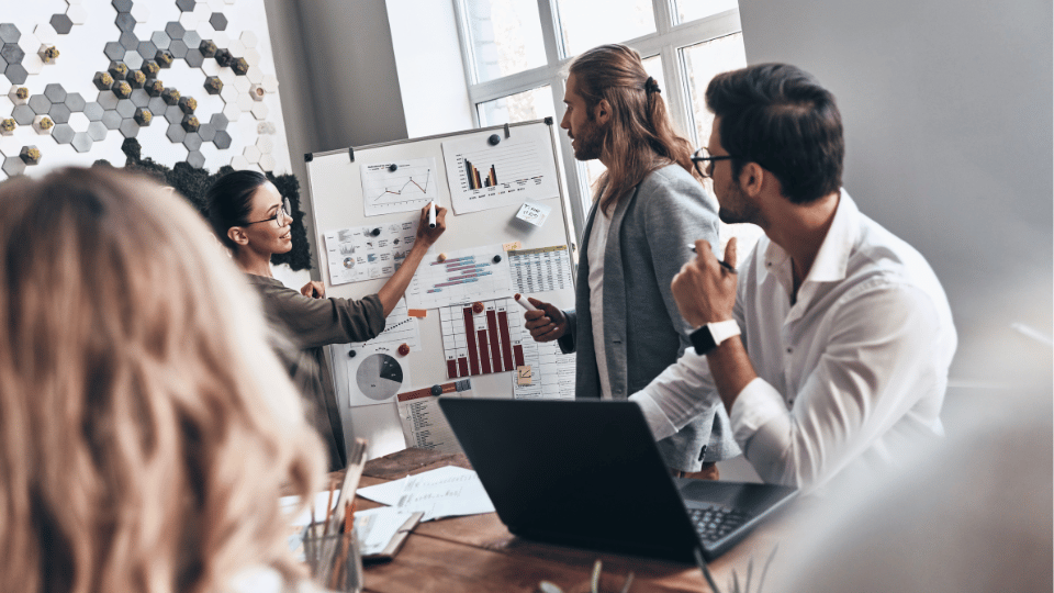 A team of professionals in a meeting working on a growth plan