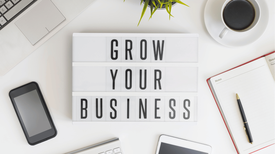 A sign that says "grow your business"
