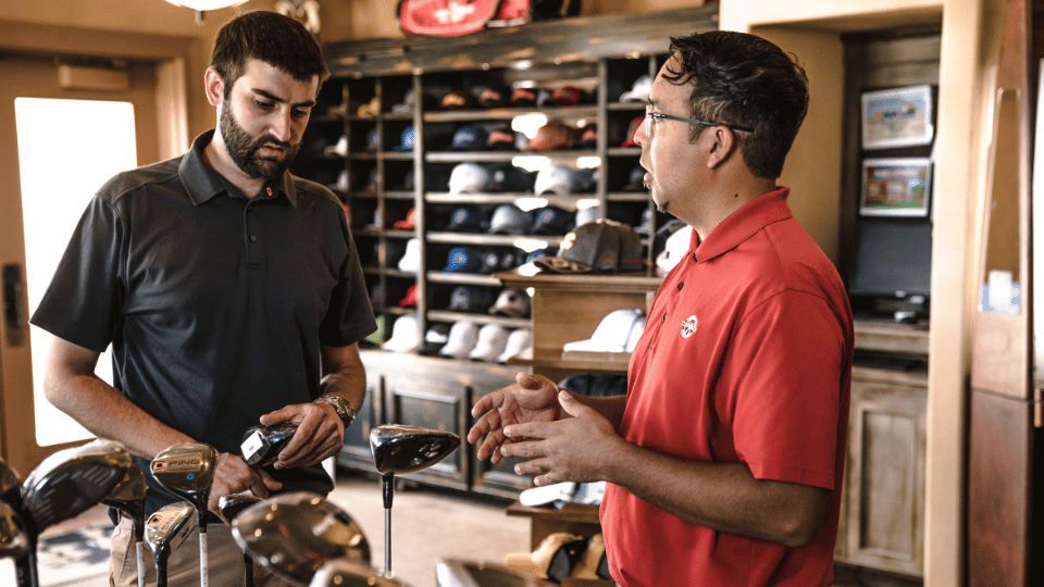 A salesperson talking to a customer