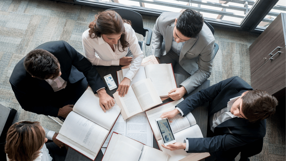 A group of business owners preparing their business for a banking crisis