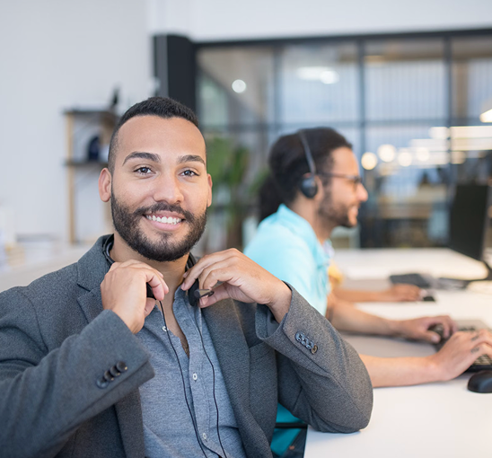 Customer service agent smiling while looking at the viewer